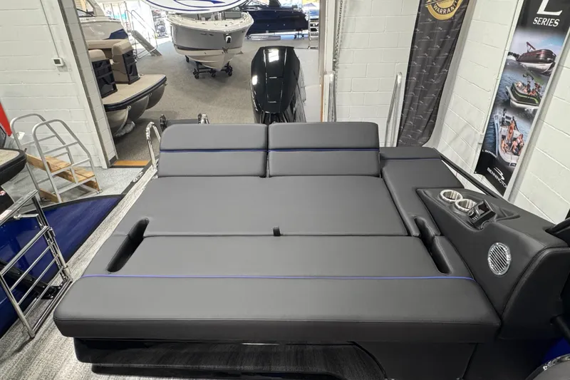 Slide: The Image of 2026 Bennington 25 QSBWASE boat interior with luxurious seating and cup holders. - 16