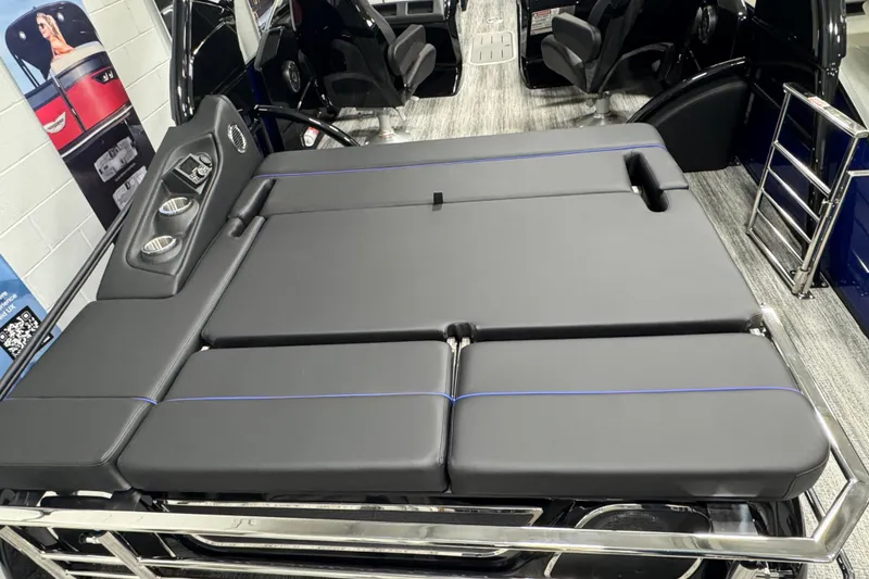 Slide: The Image of 2026 Bennington 25 QSBWASE boat interior with sleek black seating and cup holders. - 17