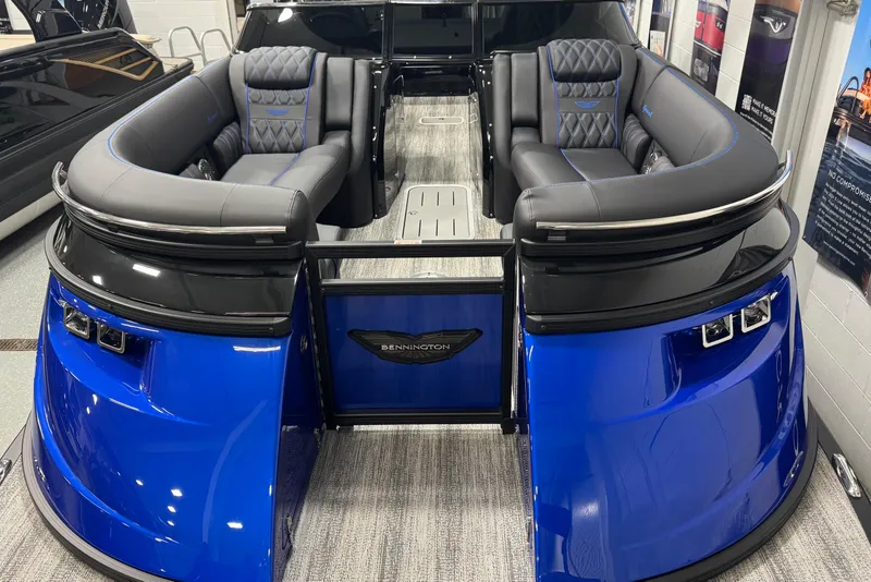 Slide: The Image of 2026 Bennington 25 QSBWASE pontoon boat with luxurious seating and sleek blue design. - 4