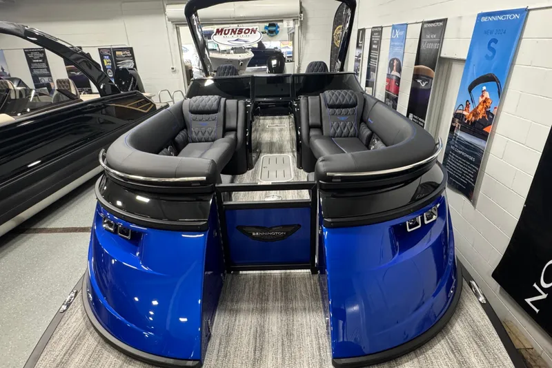 Slide: The Image of 2026 Bennington 25 QSBWASE pontoon boat with luxurious seating and sleek blue design. - 6
