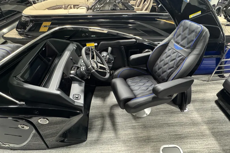 Slide: The Image of Luxurious helm of 2026 Bennington 25 QSBWASE pontoon boat with plush captain's chair. - 7