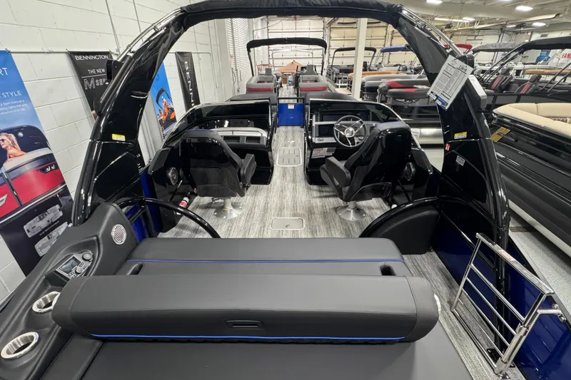 Slide: The Image of 2026 Bennington 25 QSBWASE pontoon boat interior with modern seating and steering console. - 8