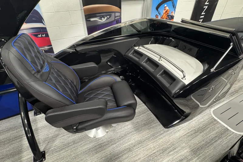 Slide: The Image of Luxurious interior of 2026 Bennington 25 QSBWASE boat with sleek black seating. - 9