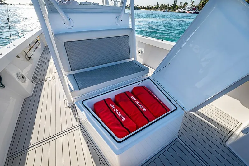 Slide: The Image of 2021 Albury Brothers 33 boat with open storage compartment containing life jackets. - 10