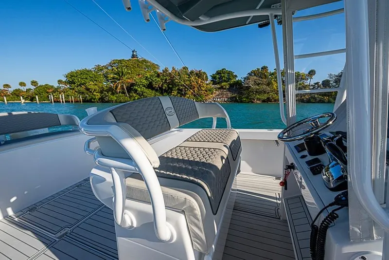 Slide: The Image of 2021 Albury Brothers 33 boat interior with helm, seating, and scenic water view. - 14