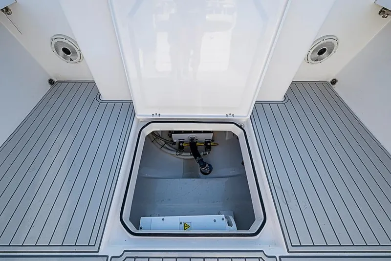 Slide: The Image of 2021 Albury Brothers 33 boat deck with open hatch, showcasing interior compartment. - 16