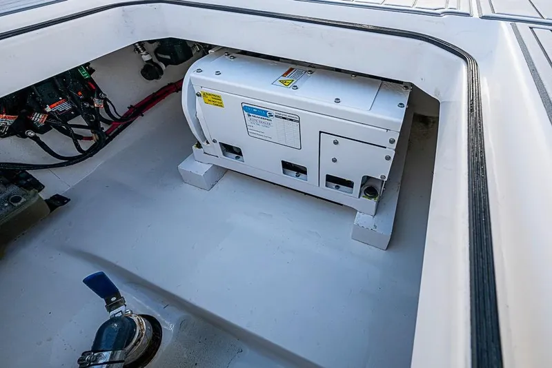 Slide: The Image of Engine compartment of a 2021 Albury Brothers 33 boat, featuring electrical components. - 17