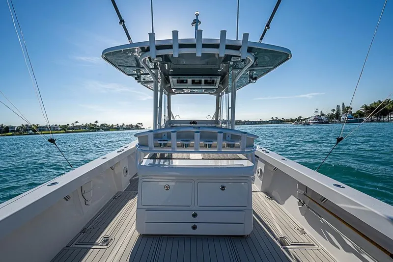 Slide: The Image of 2021 Albury Brothers 33 boat on water, clear sky, spacious deck, modern design. - 18