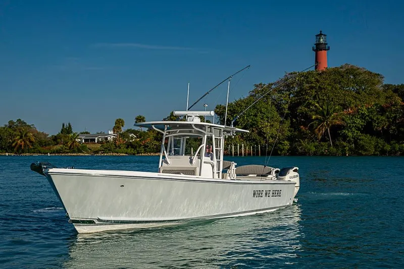 Slide: The Image of 2021 Albury Brothers 33 boat cruising near a lighthouse on a sunny day. - 24