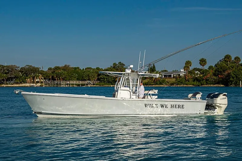 Slide: The Image of 2021 Albury Brothers 33 boat on water, side view with clear sky background. - 26