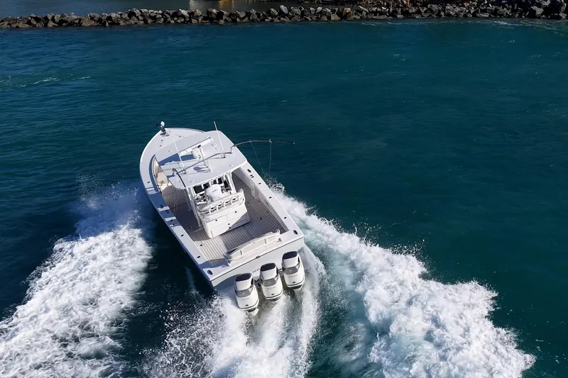 Slide: The Image of 2021 Albury Brothers 33 boat cruising on open water with powerful engines. - 29
