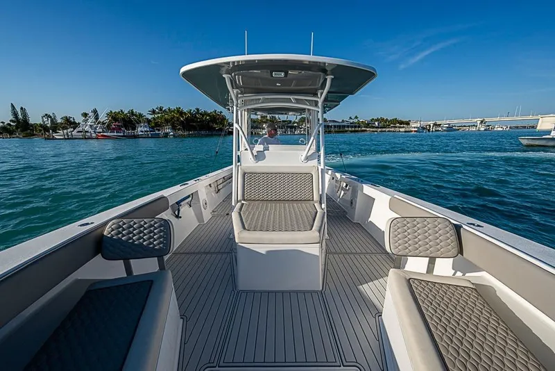 Slide: The Image of 2021 Albury Brothers 33 boat on water, featuring spacious seating and sleek design. - 9