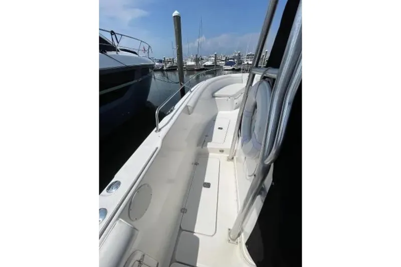Slide: The Image of 2004 Century 3200 Center Console boat docked at marina, side view. - 16