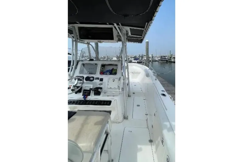 Slide: The Image of 2004 Century 3200 Center Console boat interior at marina dock. - 51