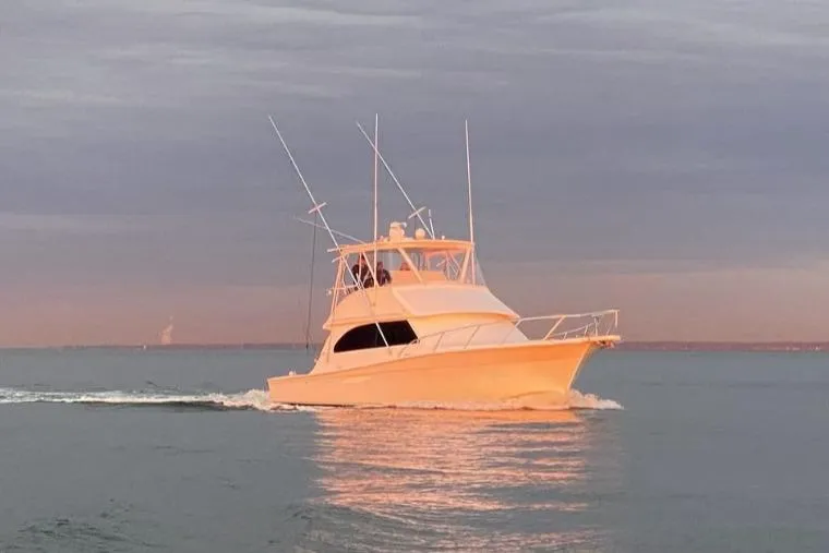 The Image of 2007 Egg Harbor 43 SportYacht cruising on calm waters at sunset. - 1