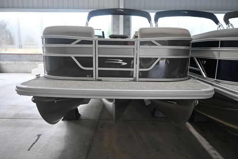 Slide: The Image of 2026 Bennington S Quad Bench 22 SSR pontoon boat in showroom. - 4