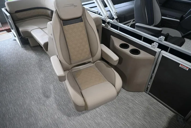 Slide: The Image of 2026 Bennington S Quad Bench 22 SSR interior with luxurious seating and cup holders. - 9