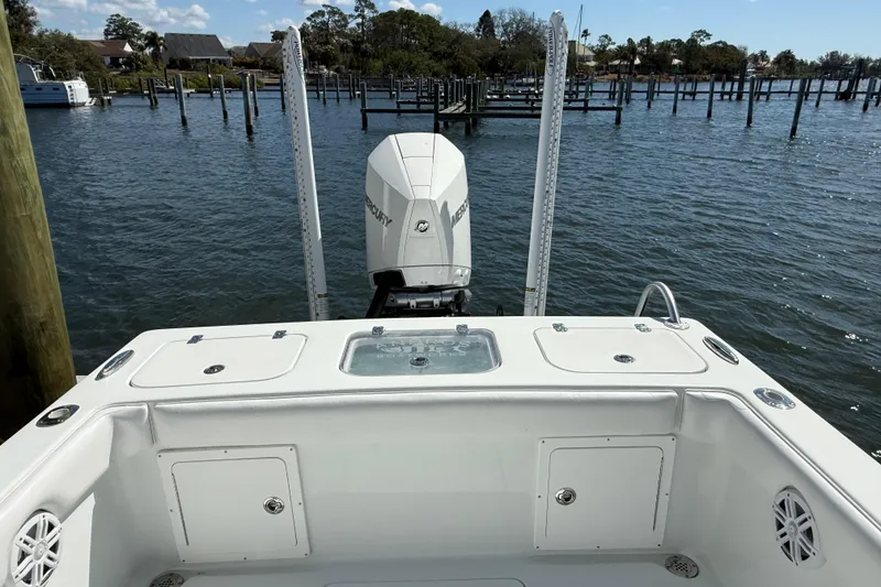 Slide: The Image of Rear view of 2023 Andros Tarpon 26 with Mercury engine. - 22