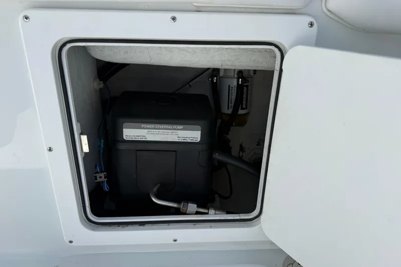 Slide: The Image of Andros Tarpon 26 2023, power steering pump in compartment. - 26