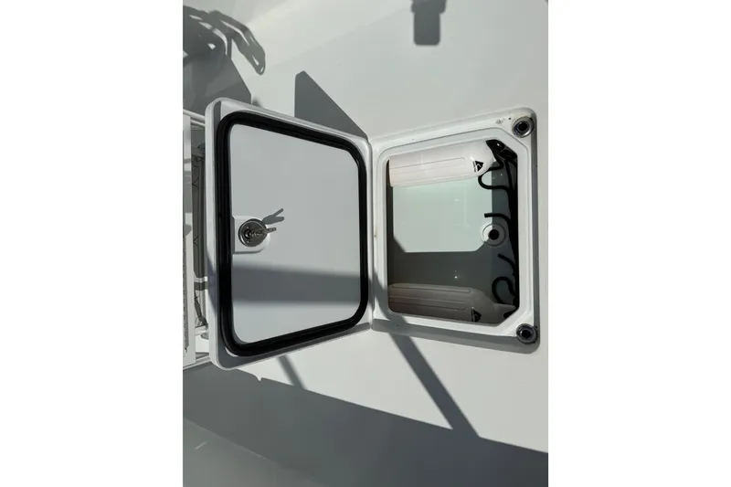 Slide: The Image of Open storage compartment on 2023 Andros Tarpon 26 boat. - 29