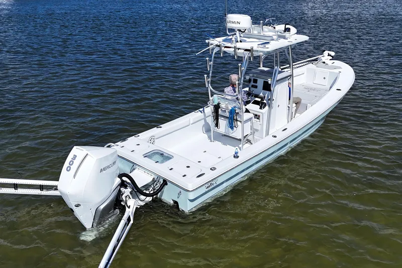 Slide: The Image of 2023 Andros Tarpon 26 boat on calm water. - 4