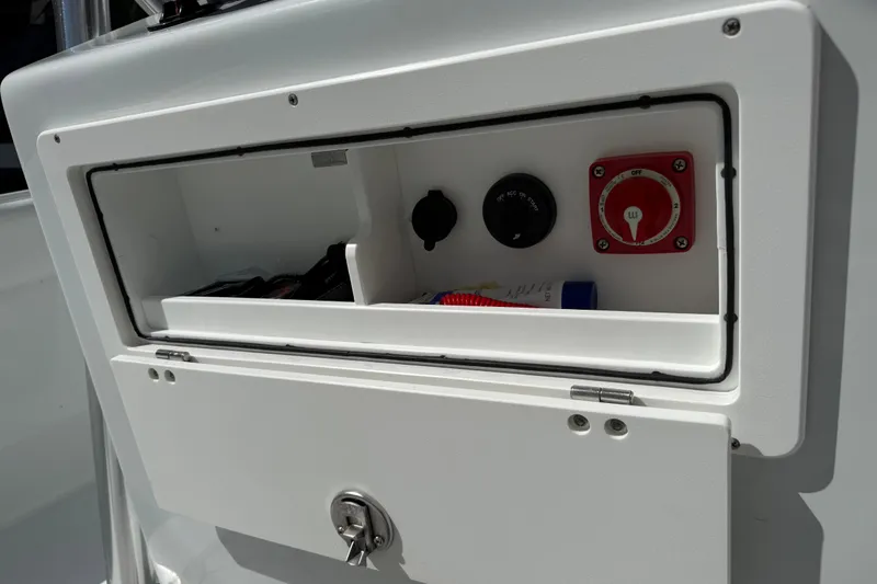 Slide: The Image of Andros Tarpon 26 2023 boat console with switch and storage. - 43