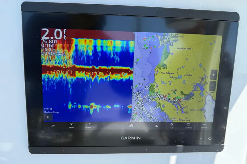 Slide: The Image of Garmin marine display on 2023 Andros Tarpon 26 showing sonar and navigation maps. - 48