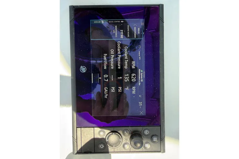 Slide: The Image of 2023 Andros Tarpon 26 boat display showing engine metrics and controls. - 49