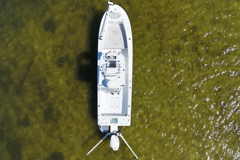 Slide: The Image of Aerial view of 2023 Andros Tarpon 26 boat in clear water. - 7