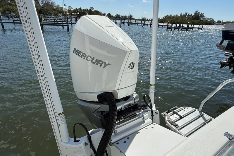 Slide: The Image of 2023 Andros Tarpon 26 with Mercury outboard motor on water. - 18