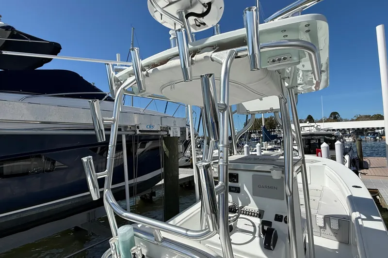 Slide: The Image of 2023 Andros Tarpon 26 boat at dock with helm console. - 34