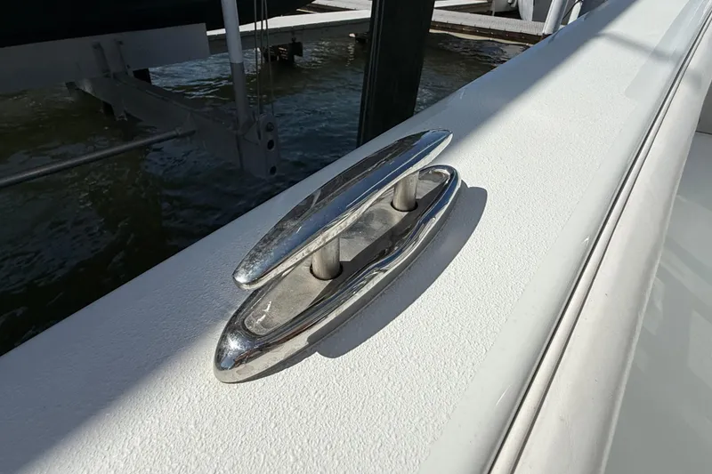 Slide: The Image of Close-up of stainless steel cleat on Andros Tarpon 26 boat, year 2023. - 40