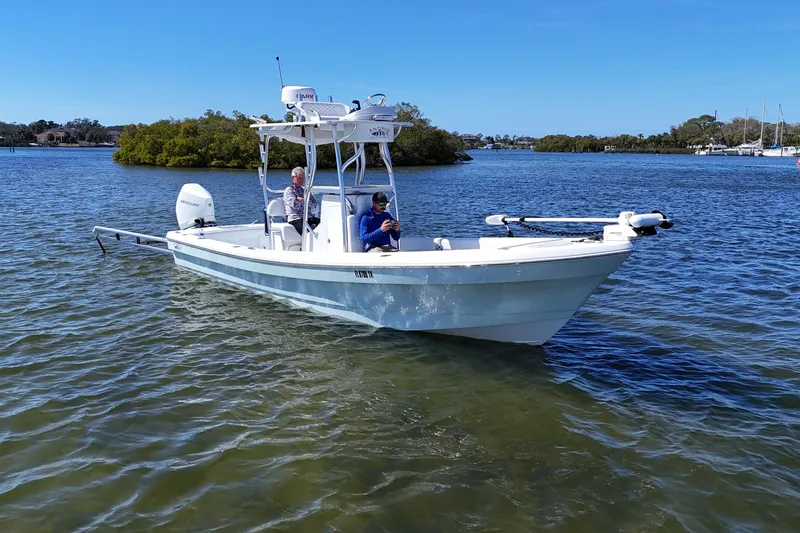 Slide: The Image of 2023 Andros Tarpon 26 boat on calm waters. - 5