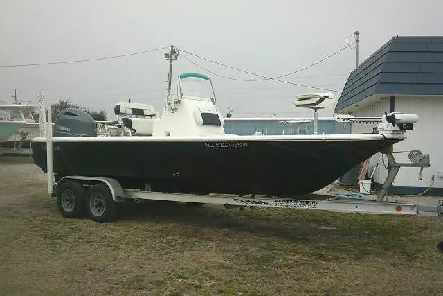 Slide: The Image of 2021 Tidewater 2110 Bay Max boat on trailer, parked outdoors. - 0