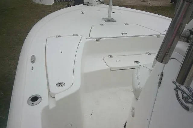 Slide: The Image of 2021 Tidewater 2110 Bay Max boat interior with white deck and seating. - 10