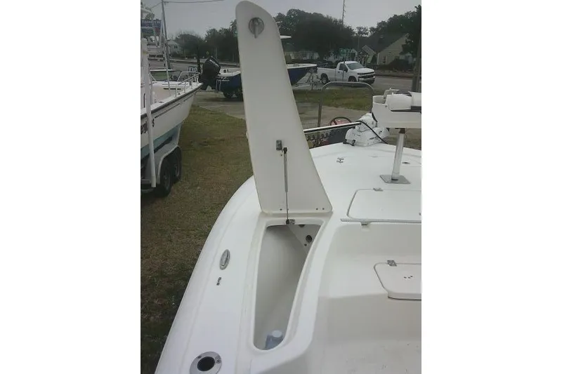 Slide: The Image of 2021 Tidewater 2110 Bay Max boat with open storage compartment on deck. - 11