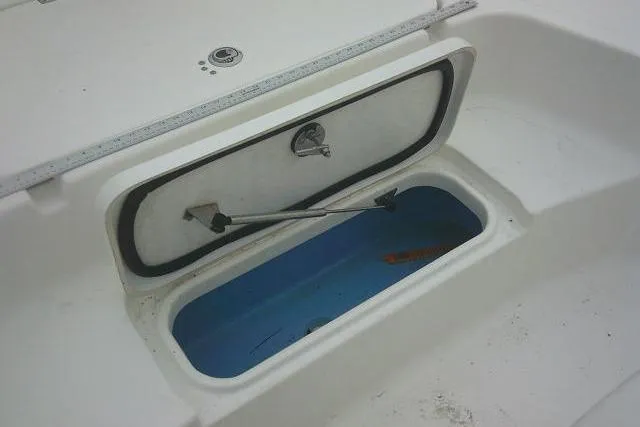 Slide: The Image of Open storage compartment on 2021 Tidewater 2110 Bay Max boat. - 13