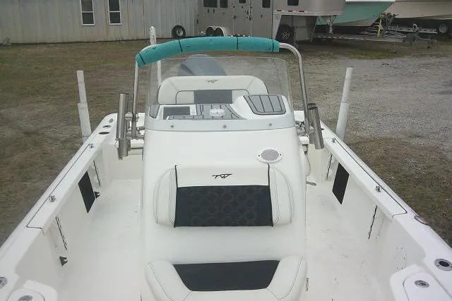 Slide: The Image of 2021 Tidewater 2110 Bay Max boat interior with seating and console. - 15