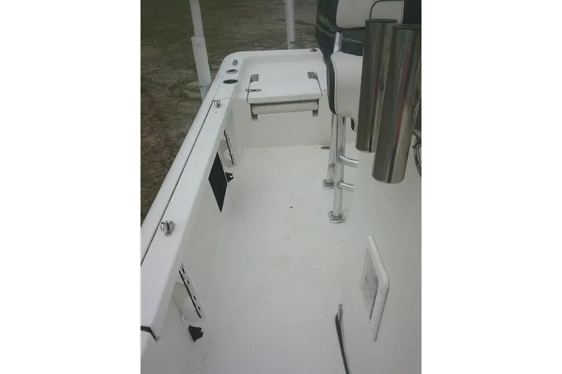 Slide: The Image of 2021 Tidewater 2110 Bay Max boat interior with seating and rod holders. - 16