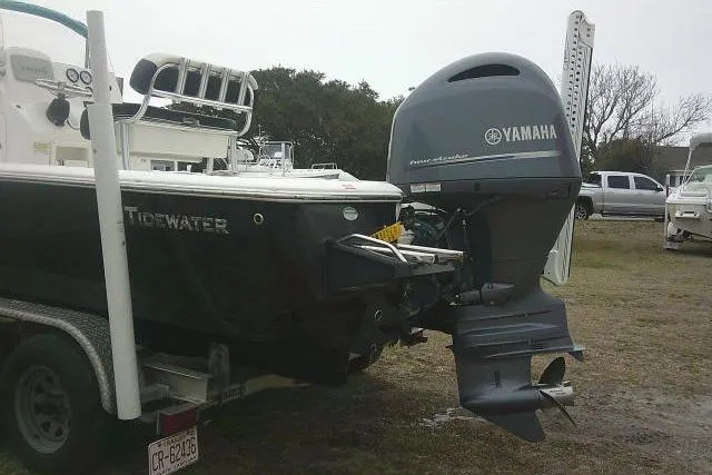 Slide: The Image of 2021 Tidewater 2110 Bay Max boat with Yamaha outboard motor on a trailer. - 2