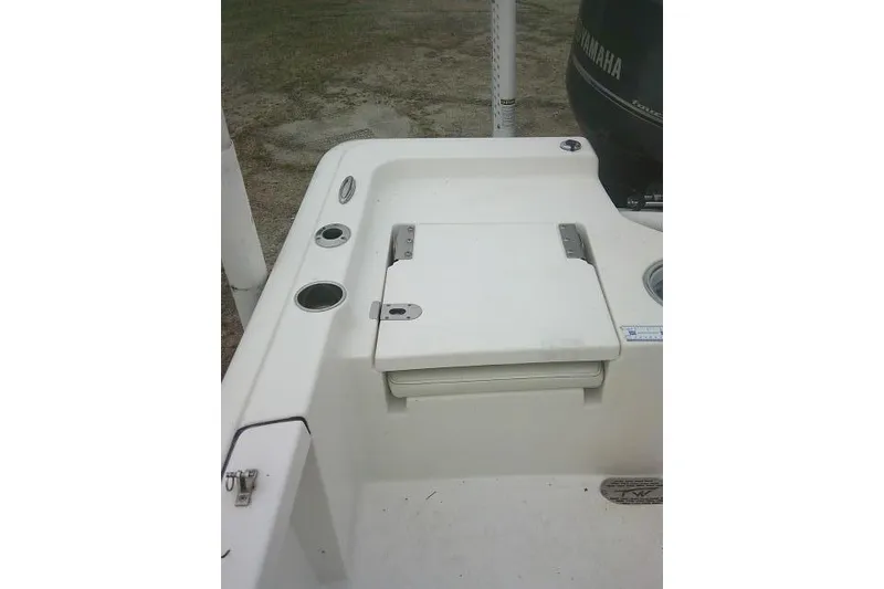 Slide: The Image of 2021 Tidewater 2110 Bay Max boat deck with storage compartment and Yamaha engine. - 24
