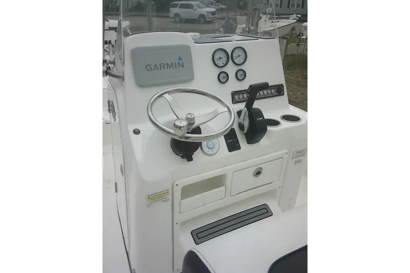 Slide: The Image of 2021 Tidewater 2110 Bay Max boat console with Garmin navigation system and steering wheel. - 29