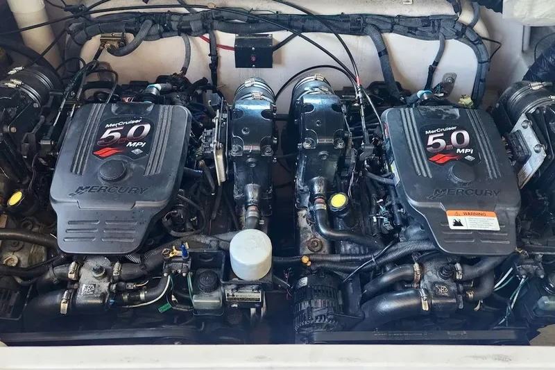 Slide: The Image of Twin MerCruiser 5.0 MPI engines in a 2007 Four Winns 310 Horizon boat. - 12