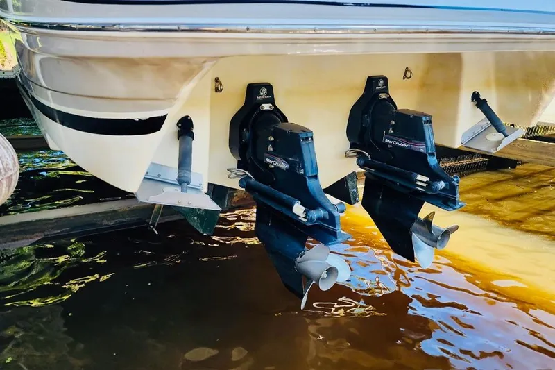 Slide: The Image of 2007 Four Winns 310 Horizon boat with dual MerCruiser outdrives in water. - 14