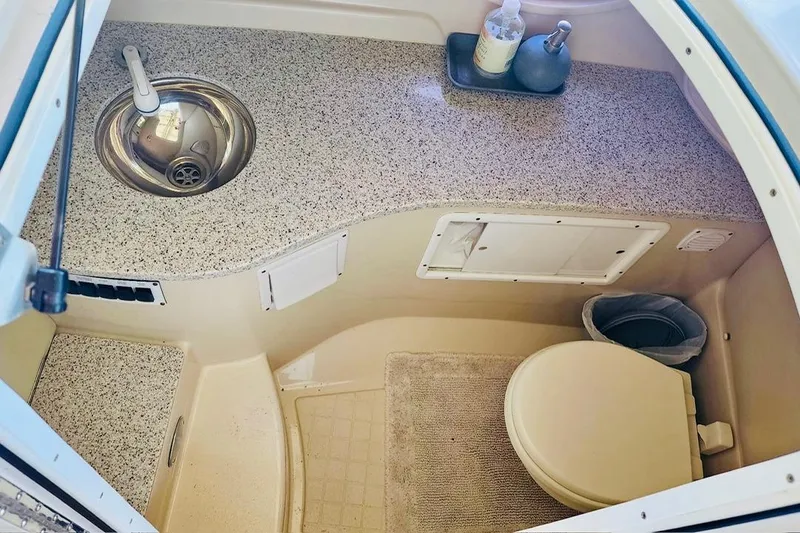 Slide: The Image of 2007 Four Winns 310 Horizon boat bathroom with sink and toilet. - 7