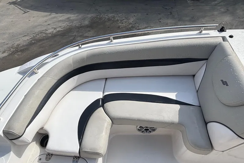 Slide: The Image of 2019 Starcraft MDX 191 O/B boat interior with cushioned seating and sleek design. - 21