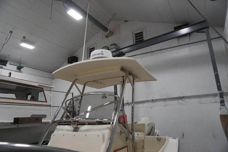 Slide: The Image of 2003 Padebco 23 boat in a garage with Garmin equipment. - 15