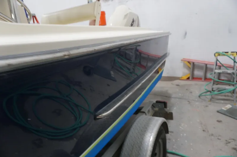 Slide: The Image of 2003 Padebco 23 boat in workshop, side view with trailer and equipment. - 17