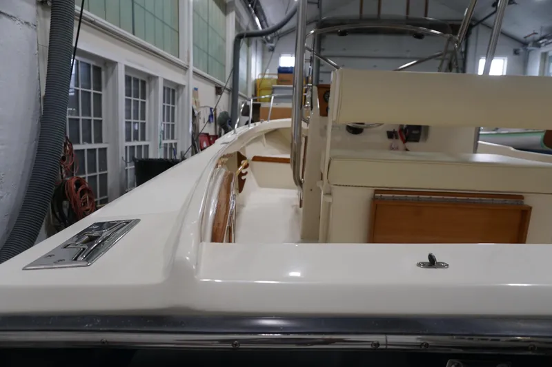 Slide: The Image of 2003 Padebco 23 boat interior in a workshop setting. - 23