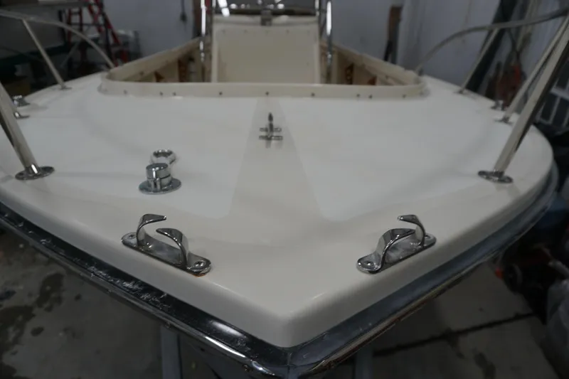 Slide: The Image of 2003 Padebco 23 boat deck with stainless steel fittings in a workshop setting. - 33